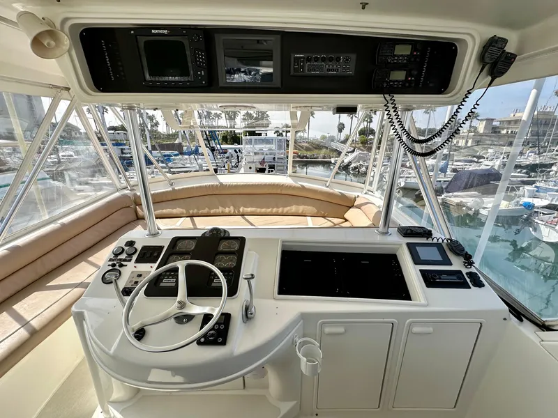 Slide: The Image of Cockpit of 1997 Ocean Yachts 60 Super Sport with steering wheel and navigation equipment. - 27