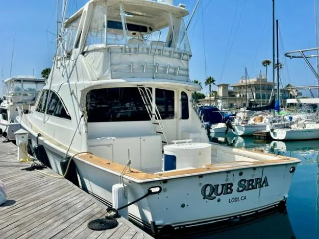 Slide: The Image of 1997 Ocean Yachts 60 Super Sport docked at marina, rear view. - 3