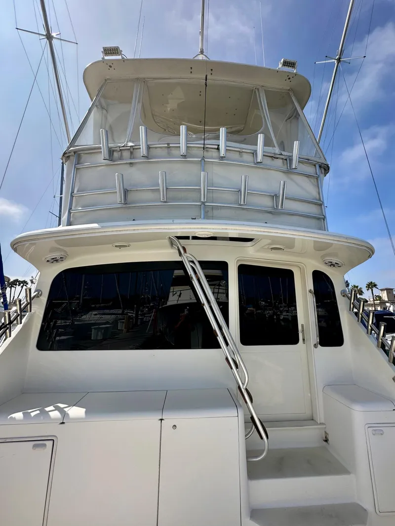 Slide: The Image of 1997 Ocean Yachts 60 Super Sport, rear view, showcasing sleek design and spacious deck. - 31