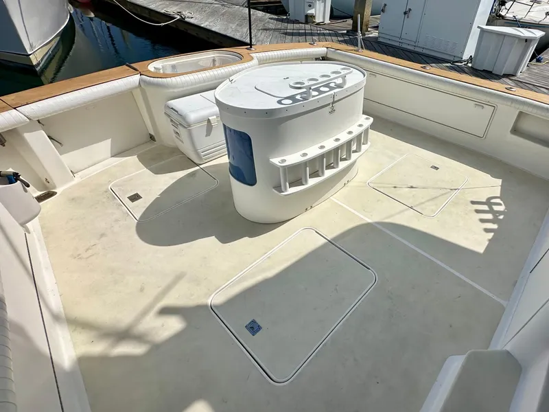 Slide: The Image of 1997 Ocean Yachts 60 Super Sport deck with fishing station and storage compartments. - 32