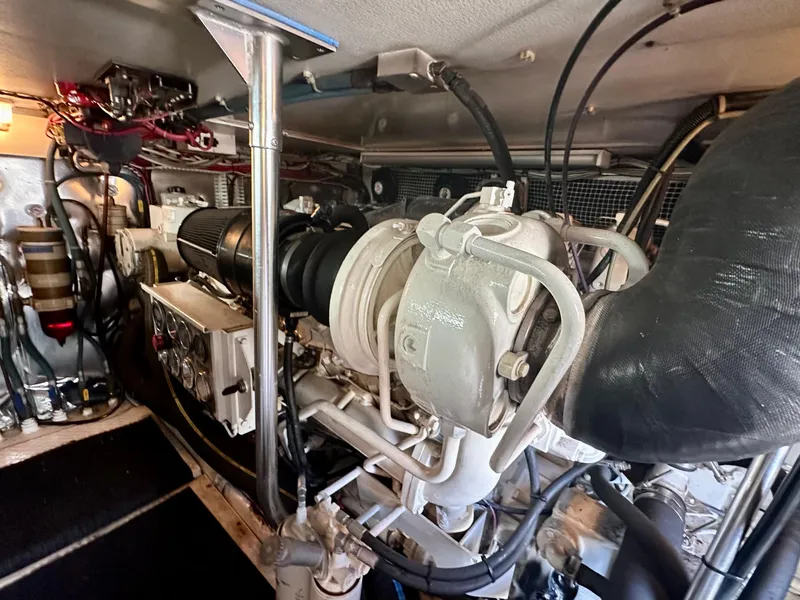 Slide: The Image of Engine room of a 1997 Ocean Yachts 60 Super Sport, showcasing mechanical components. - 35