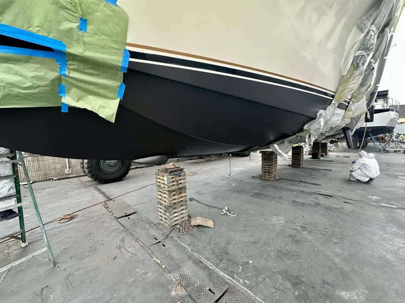 Slide: The Image of 1997 Ocean Yachts 60 Super Sport undergoing maintenance on dry dock. - 36