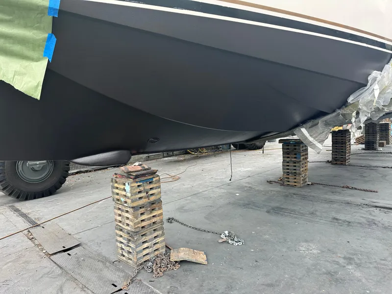 Slide: The Image of 1997 Ocean Yachts 60 Super Sport on blocks for maintenance. - 38