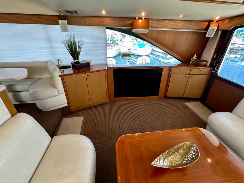 Slide: The Image of Luxurious interior of 1997 Ocean Yachts 60 Super Sport with elegant seating and large windows. - 6