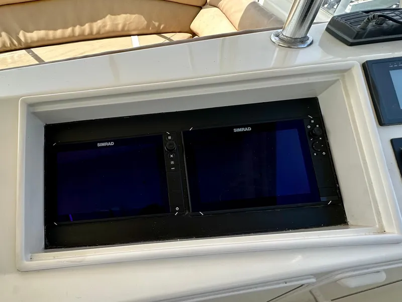 Slide: The Image of Control panel of a 1997 Ocean Yachts 60 Super Sport with dual Simrad displays. - 29