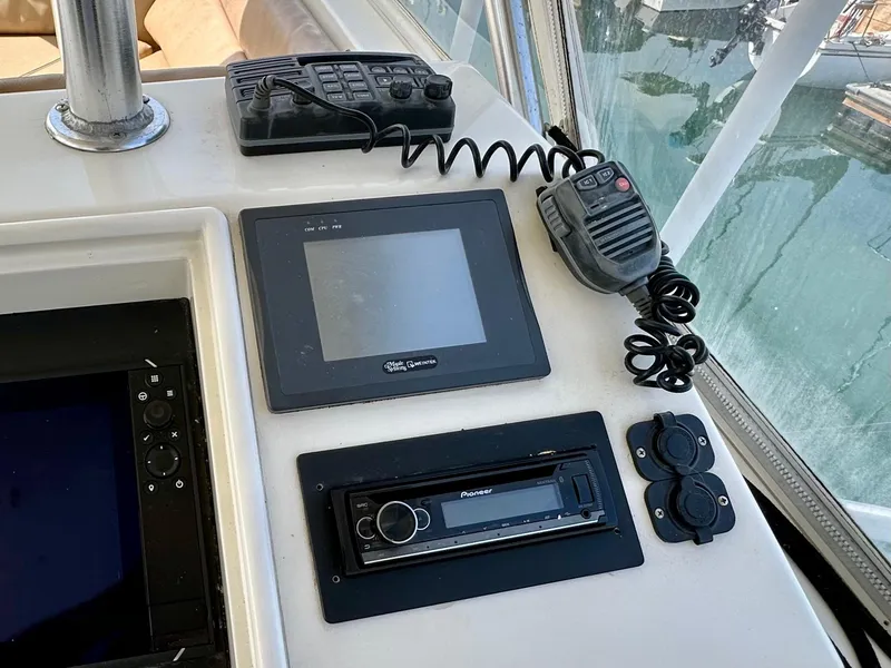 Slide: The Image of Control panel of a 1997 Ocean Yachts 60 Super Sport with navigation and communication equipment. - 30