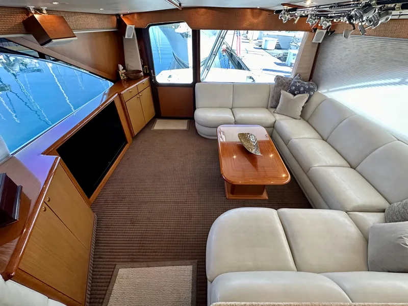 Slide: The Image of Luxurious interior of a 1997 Ocean Yachts 60 Super Sport with plush seating and elegant decor. - 4
