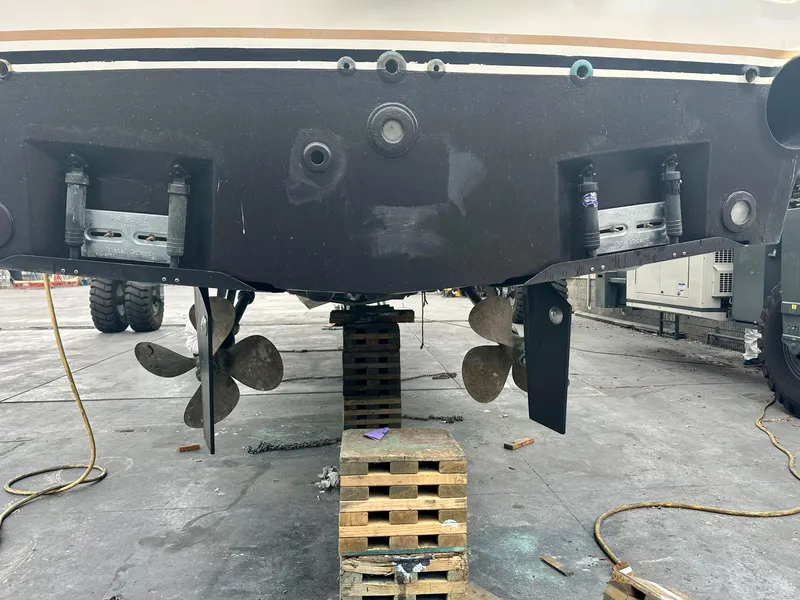 Slide: The Image of 1997 Ocean Yachts 60 Super Sport on dry dock, showing propellers and rudders. - 42