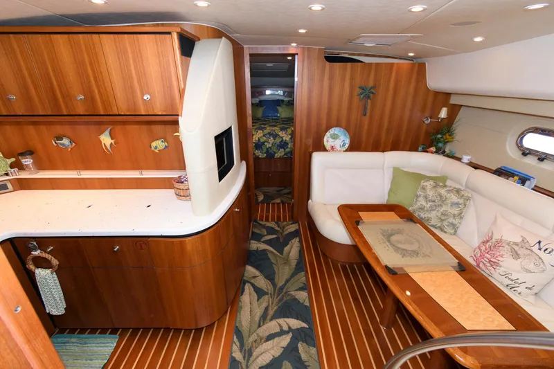 Slide: The Image of Luxurious 2006 Tiara Yachts 4300 Sovran interior with elegant wood finishes and cozy seating. - 14