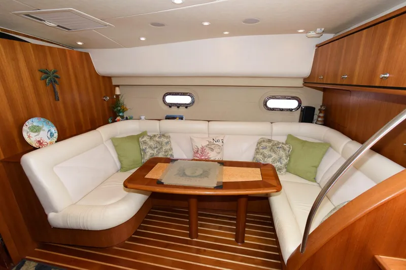 Slide: The Image of Luxurious interior of 2006 Tiara Yachts 4300 Sovran with elegant seating and wooden accents. - 15