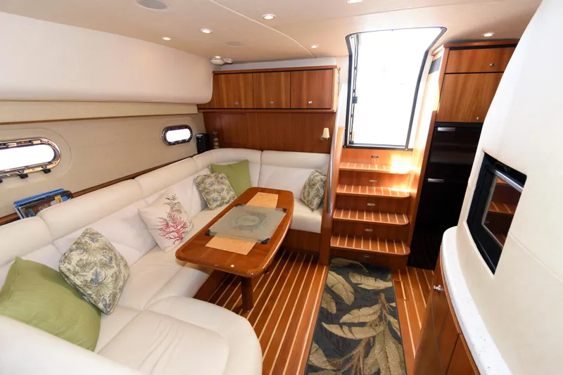 Slide: The Image of Luxurious interior of 2006 Tiara Yachts 4300 Sovran with elegant seating and wooden finishes. - 17