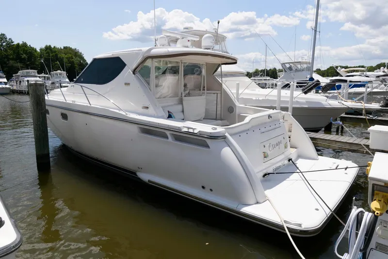 Slide: The Image of 2006 Tiara Yachts 4300 Sovran docked at marina, side view. - 2
