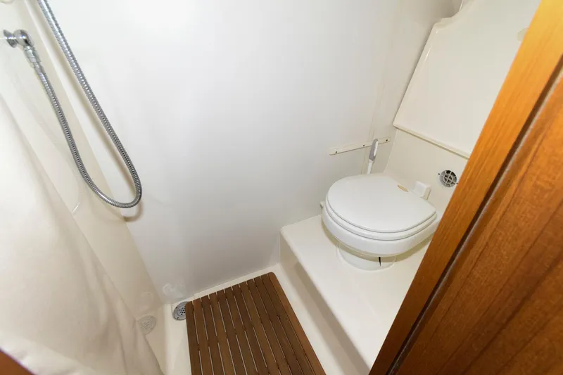 Slide: The Image of Bathroom interior of 2006 Tiara Yachts 4300 Sovran, featuring shower and toilet. - 23