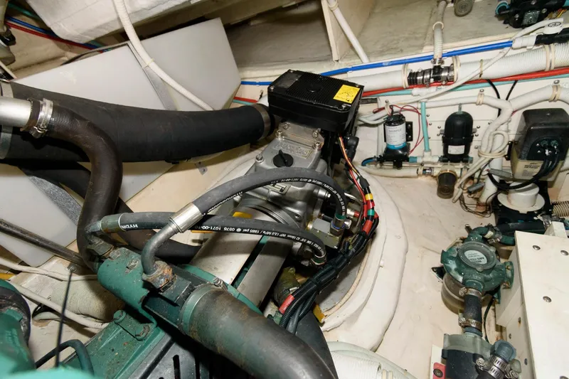 Slide: The Image of Engine room of 2006 Tiara Yachts 4300 Sovran, showcasing mechanical components and wiring. - 27