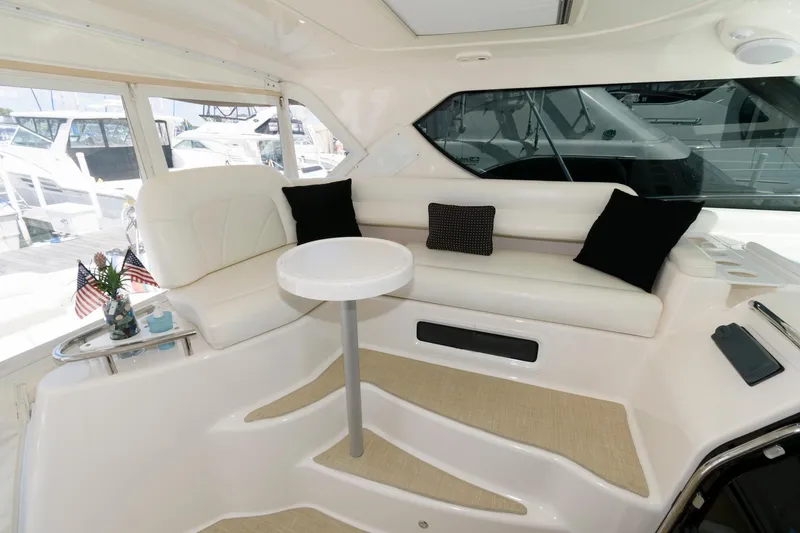 Slide: The Image of Luxurious interior of 2006 Tiara Yachts 4300 Sovran with plush seating and table. - 5