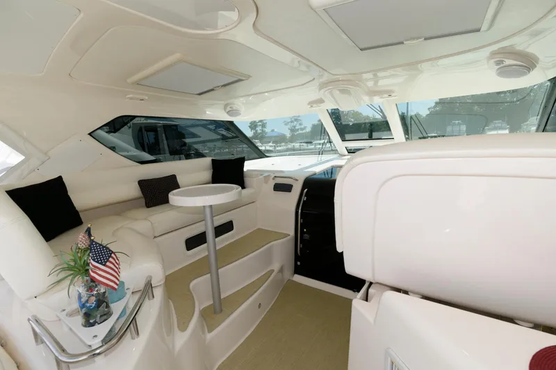 Slide: The Image of Luxurious interior of 2006 Tiara Yachts 4300 Sovran with plush seating and elegant design. - 6