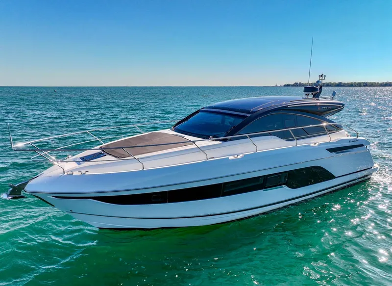 Slide: The Image of 2024 Fairline Targa 45 GT yacht cruising on clear blue water. - 0