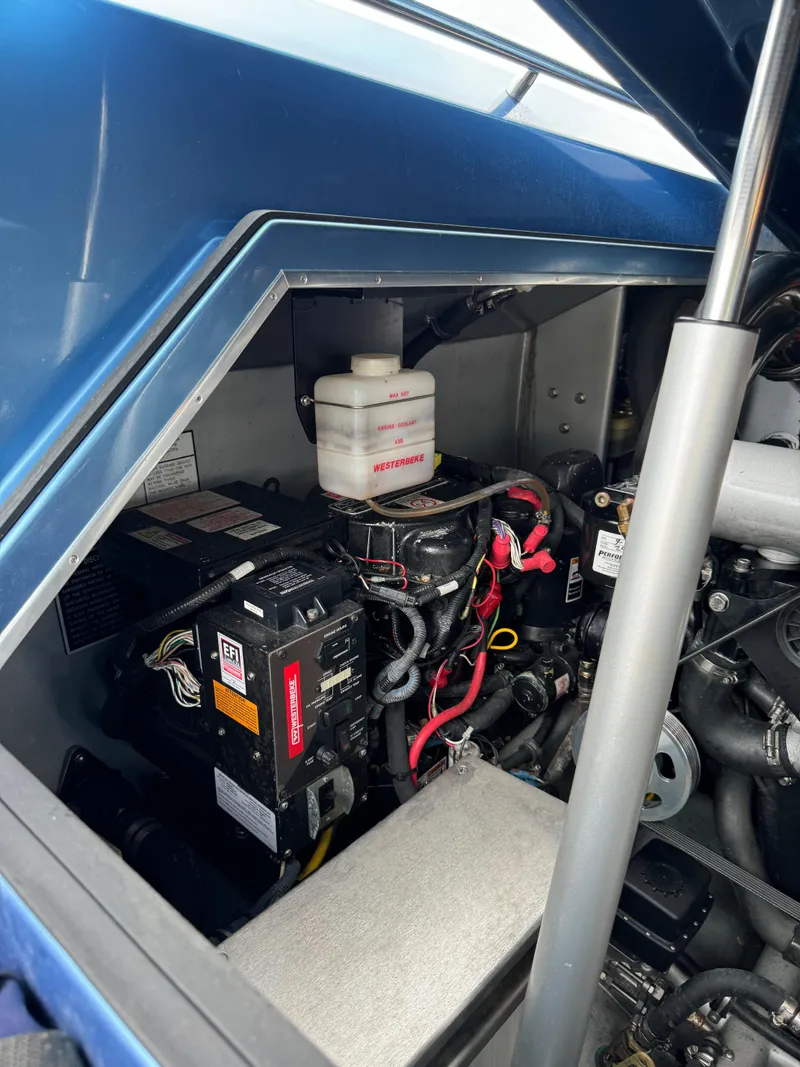 Slide: The Image of Engine compartment of a 2013 Nor-Tech 420 Monte Carlo boat, showcasing mechanical components. - 19