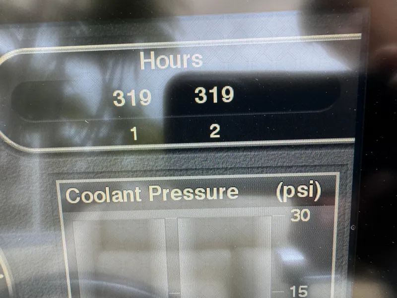 Slide: The Image of Dashboard display showing 319 hours and coolant pressure for 2013 Nor-Tech 420 Monte Carlo. - 23