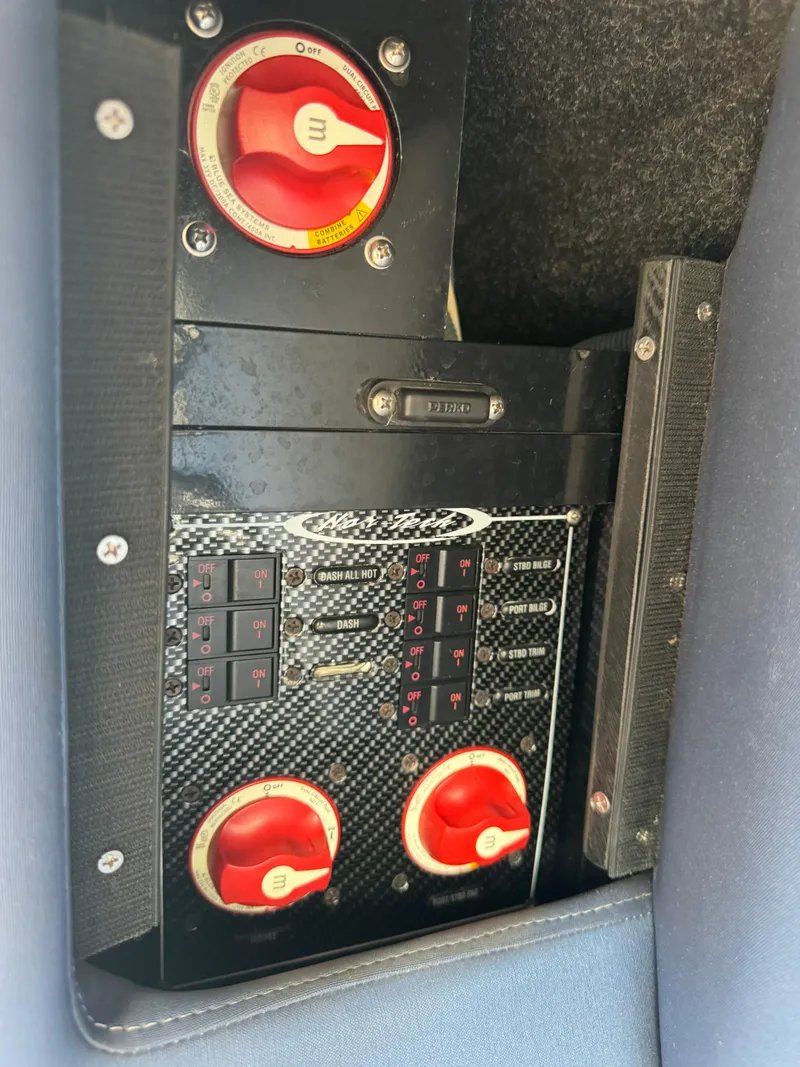 Slide: The Image of Control panel of 2013 Nor-Tech 420 Monte Carlo boat with switches and dials. - 24