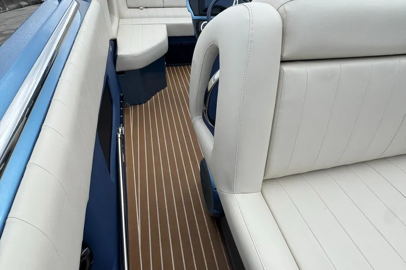 Slide: The Image of 2013 Nor-Tech 420 Monte Carlo interior with white seating and wood-patterned flooring. - 29