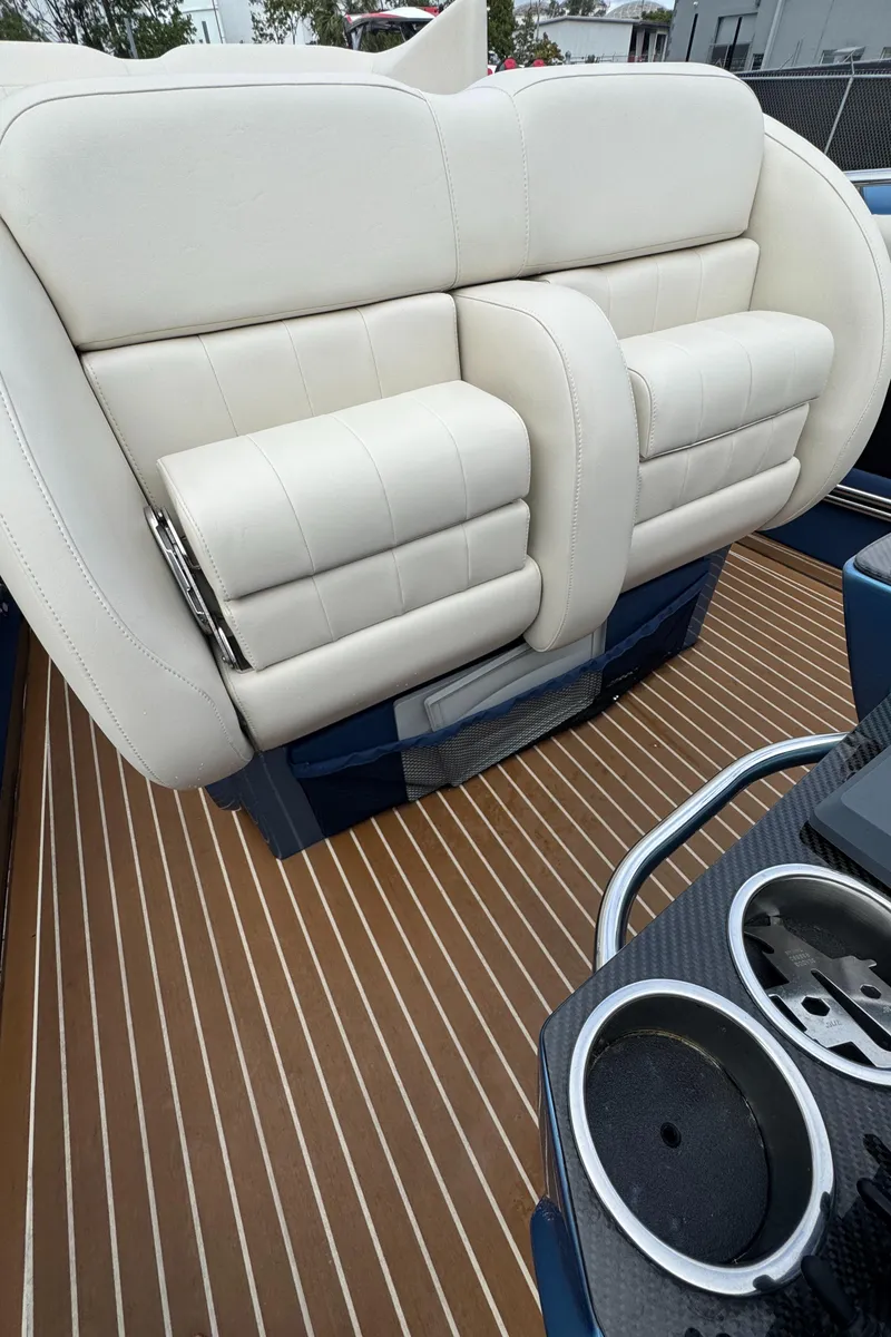 Slide: The Image of Luxury seating on 2013 Nor-Tech 420 Monte Carlo boat with sleek design and cup holders. - 30