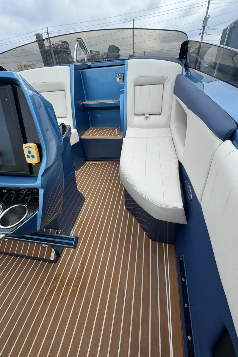 Slide: The Image of 2013 Nor-Tech 420 Monte Carlo interior with sleek seating and modern design. - 31