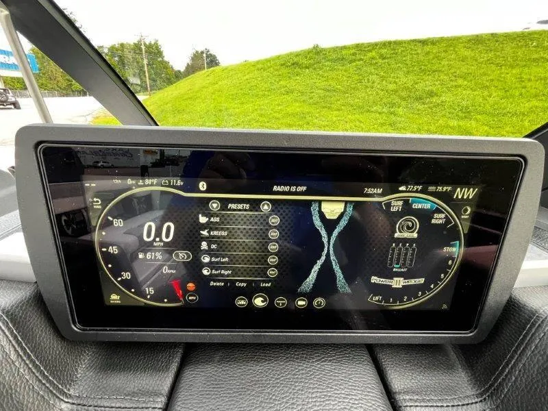 Slide: The Image of Dashboard display of a 2020 Malibu 25 LSV boat, showing speed and surf settings. - 14