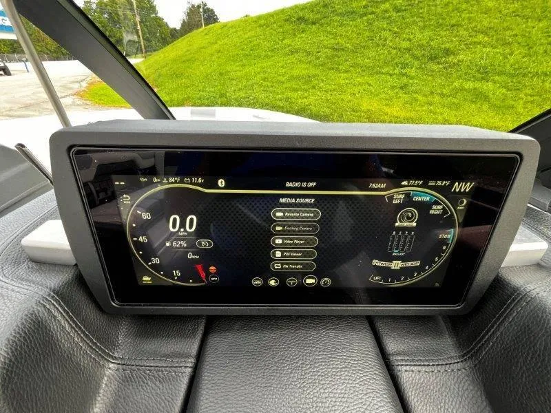 Slide: The Image of Dashboard display of a 2020 Malibu 25 LSV boat showing speed and media controls. - 15