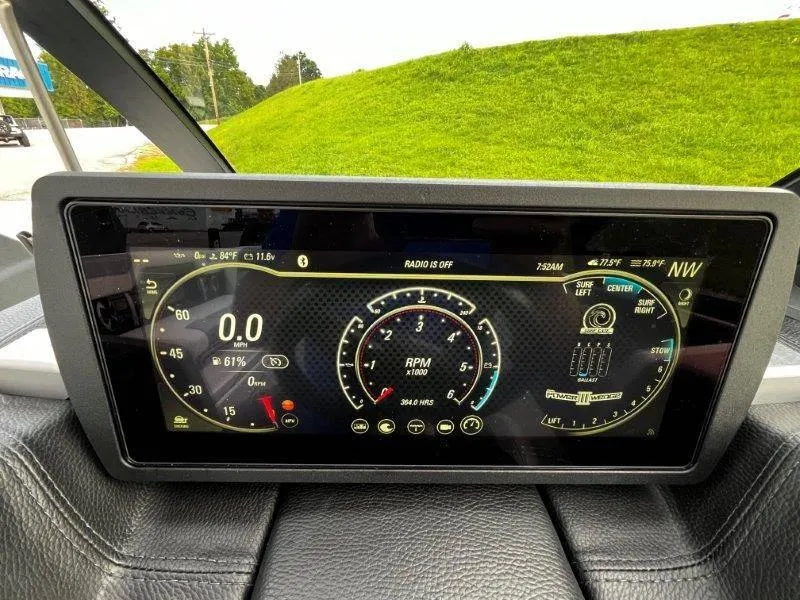 Slide: The Image of Dashboard display of a 2020 Malibu 25 LSV boat showing speed and RPM gauges. - 17