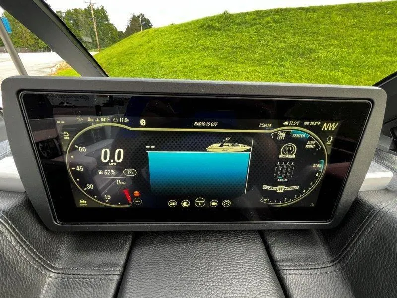 Slide: The Image of 2020 Malibu 25 LSV dashboard display with speedometer and control settings. - 18
