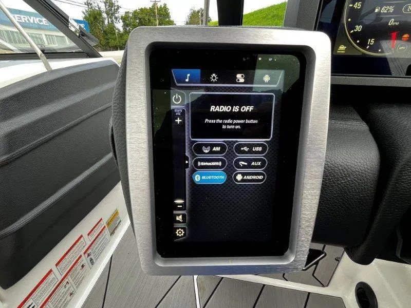 Slide: The Image of 2020 Malibu 25 LSV boat dashboard with touchscreen radio controls. - 19
