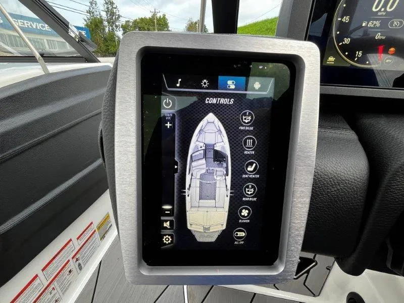Slide: The Image of Touchscreen controls of a 2020 Malibu 25 LSV boat dashboard. - 22