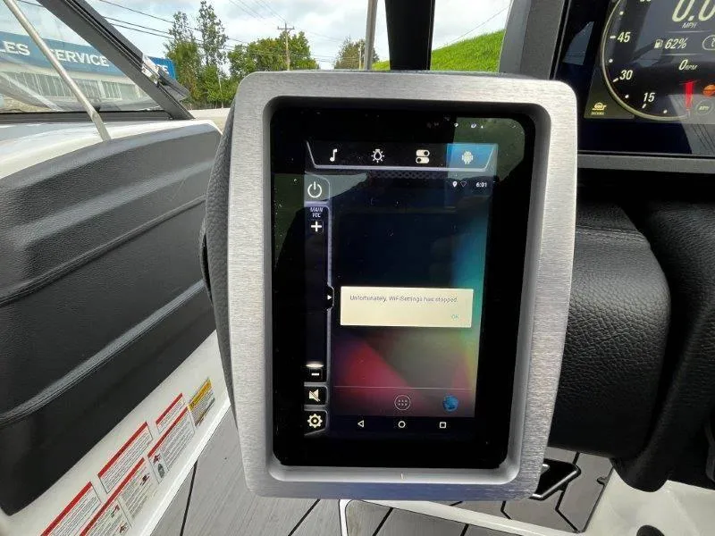 Slide: The Image of 2020 Malibu 25 LSV boat dashboard with touchscreen display showing error message. - 23