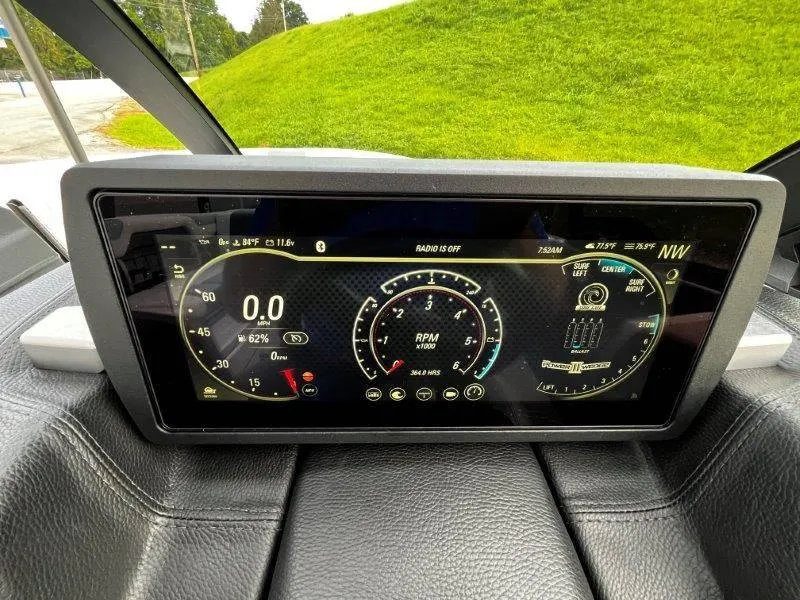 Slide: The Image of Dashboard display of a 2020 Malibu 25 LSV boat showing speed and RPM gauges. - 24