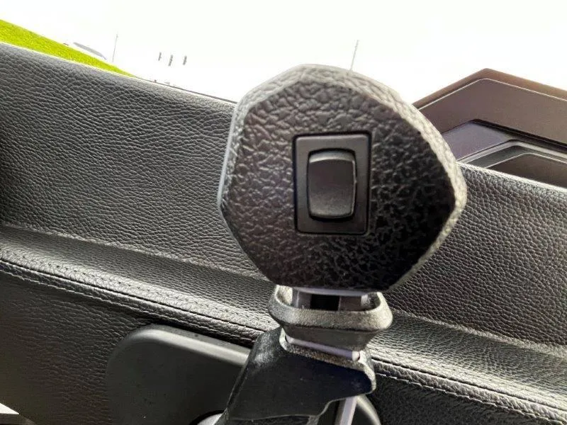 Slide: The Image of Close-up of a 2020 Malibu 25 LSV boat control lever. - 25