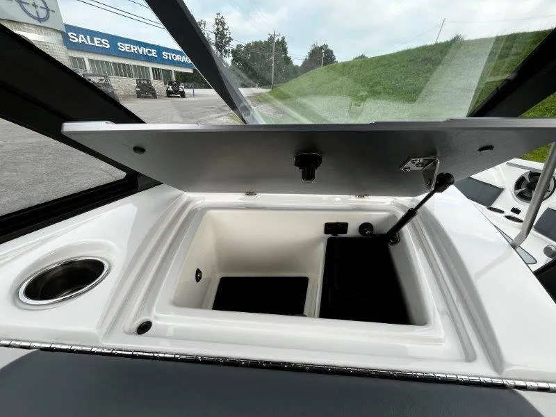 Slide: The Image of 2020 Malibu 25 LSV boat storage compartment open, showing interior details. - 31