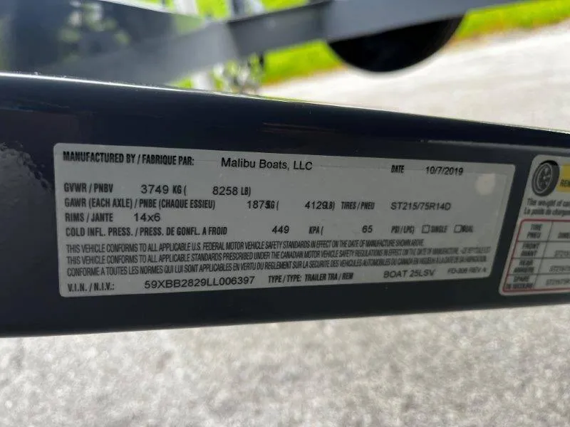 Slide: The Image of Label on Malibu 25 LSV trailer, detailing specifications and compliance information. - 9