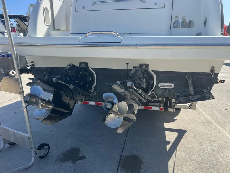 Slide: The Image of 2006 Formula 31 Cruiser boat with dual propellers, docked on a sunny day. - 15