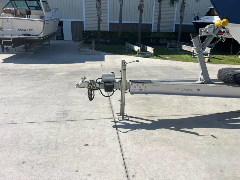 Slide: The Image of 2006 Formula 31 Cruiser trailer hitch in a boatyard setting. - 16