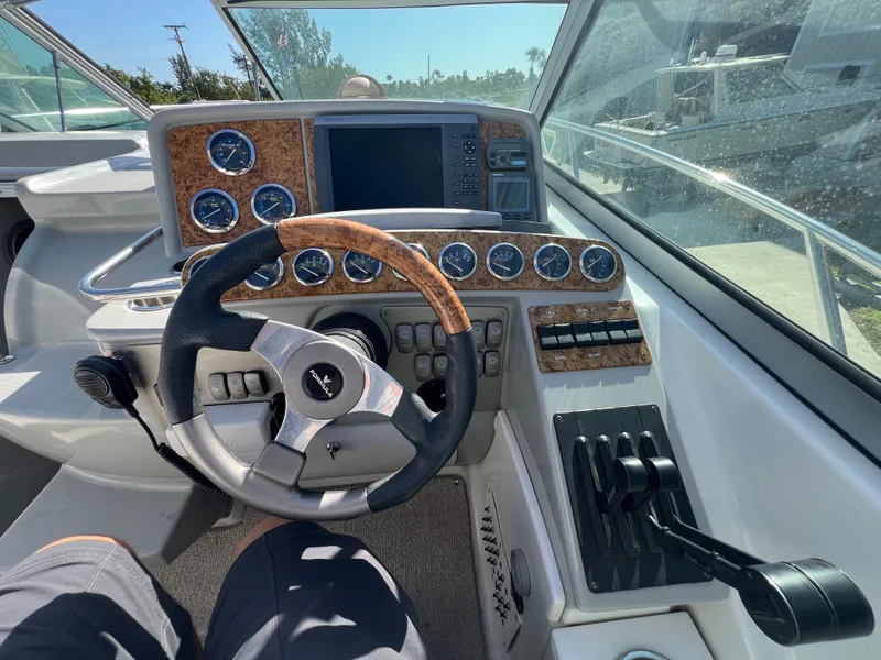 Slide: The Image of 2006 Formula 31 Cruiser helm with steering wheel, gauges, and control panel. - 2