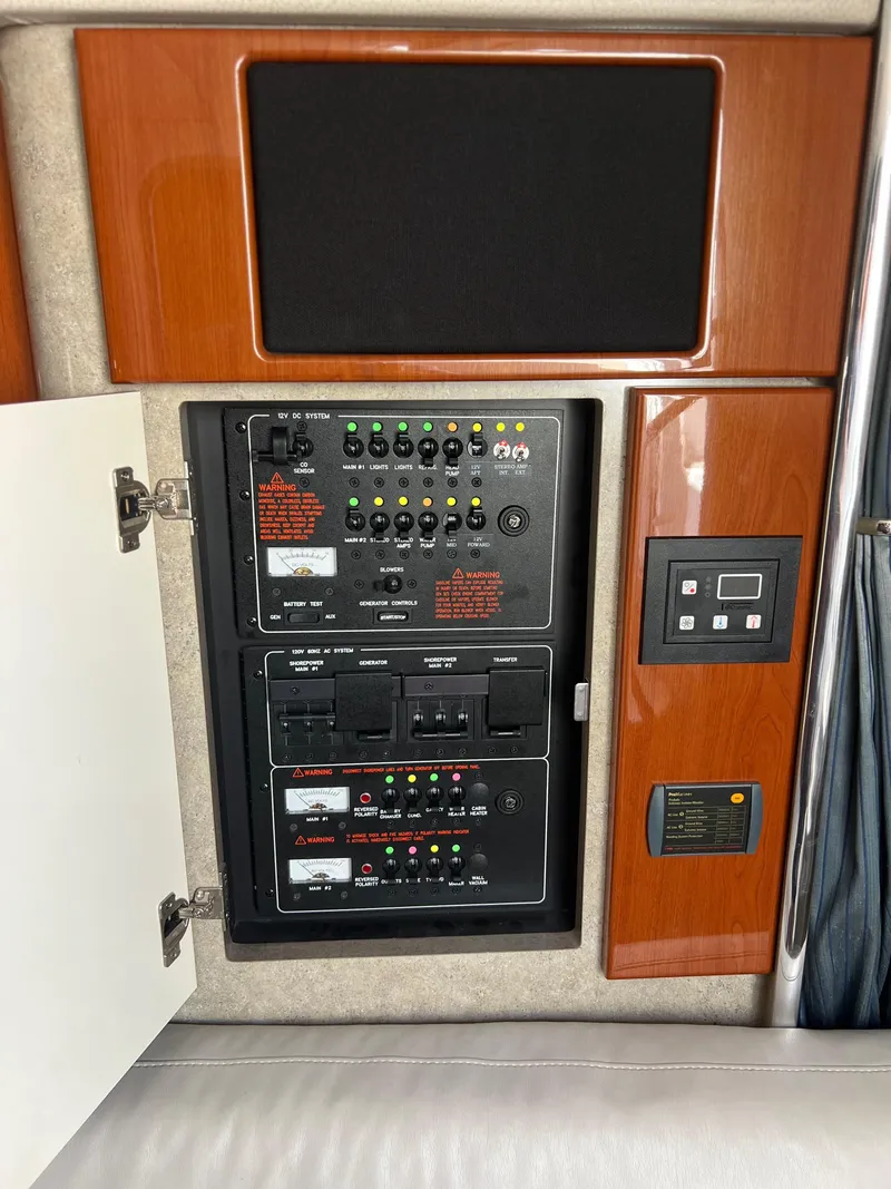 Slide: The Image of Control panel inside 2006 Formula 31 Cruiser boat, featuring switches and electronic controls. - 4