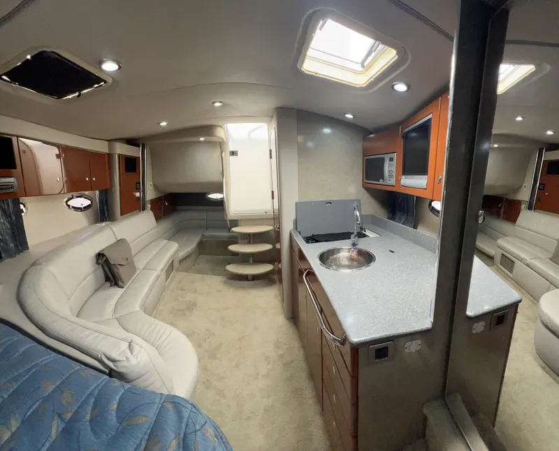 Slide: The Image of Interior of 2006 Formula 31 Cruiser with modern kitchen and seating area. - 5