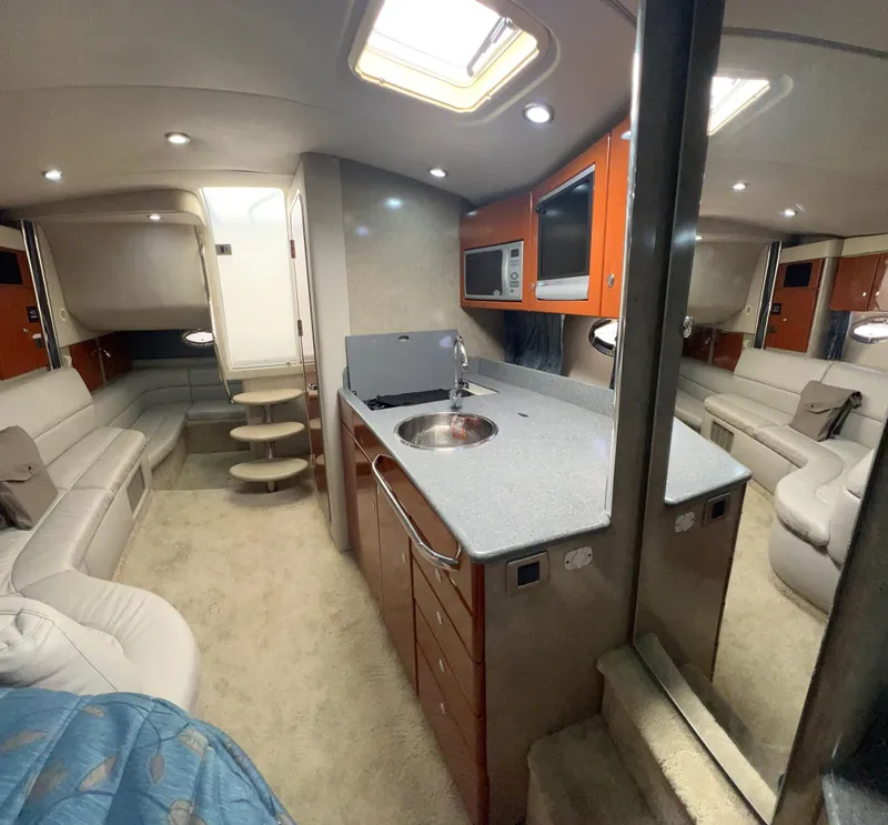 Slide: The Image of Interior of 2006 Formula 31 Cruiser with modern kitchen and seating area. - 6