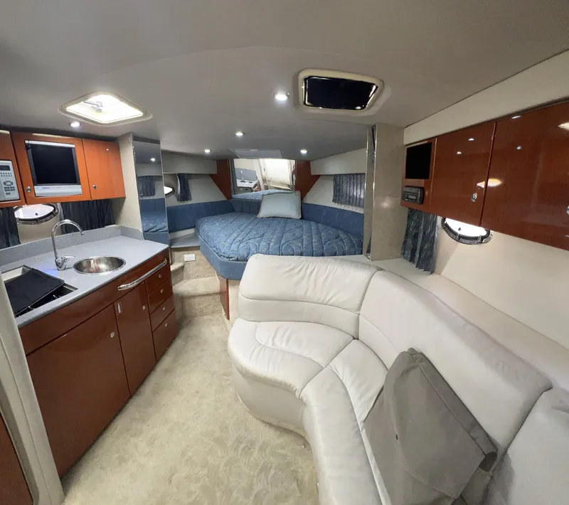 Slide: The Image of Interior of 2006 Formula 31 Cruiser with modern kitchen and cozy seating area. - 7