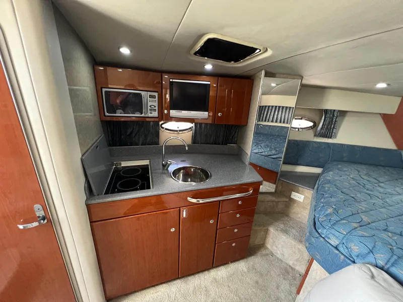Slide: The Image of Interior of 2006 Formula 31 Cruiser with kitchenette and sleeping area. - 8