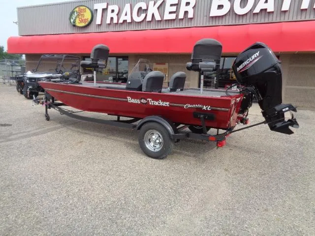 Slide: The Image of 2024 Tracker Bass Tracker Classic XL boat with Mercury engine at dealership. - 2