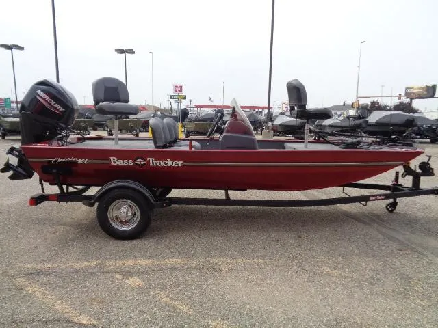 Slide: The Image of 2024 Tracker Bass Tracker Classic XL boat on trailer in parking lot. - 3