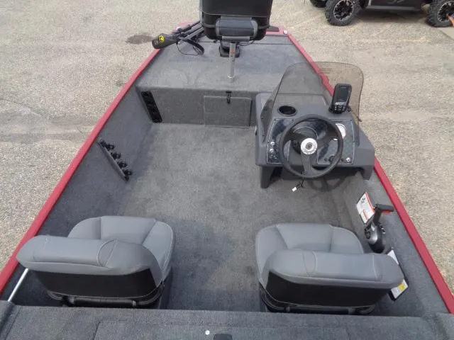 Slide: The Image of 2024 Tracker Bass Tracker Classic XL boat interior with steering console and seating. - 6