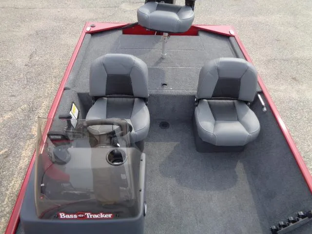 Slide: The Image of 2024 Tracker Bass Tracker Classic XL boat interior with three gray seats. - 9